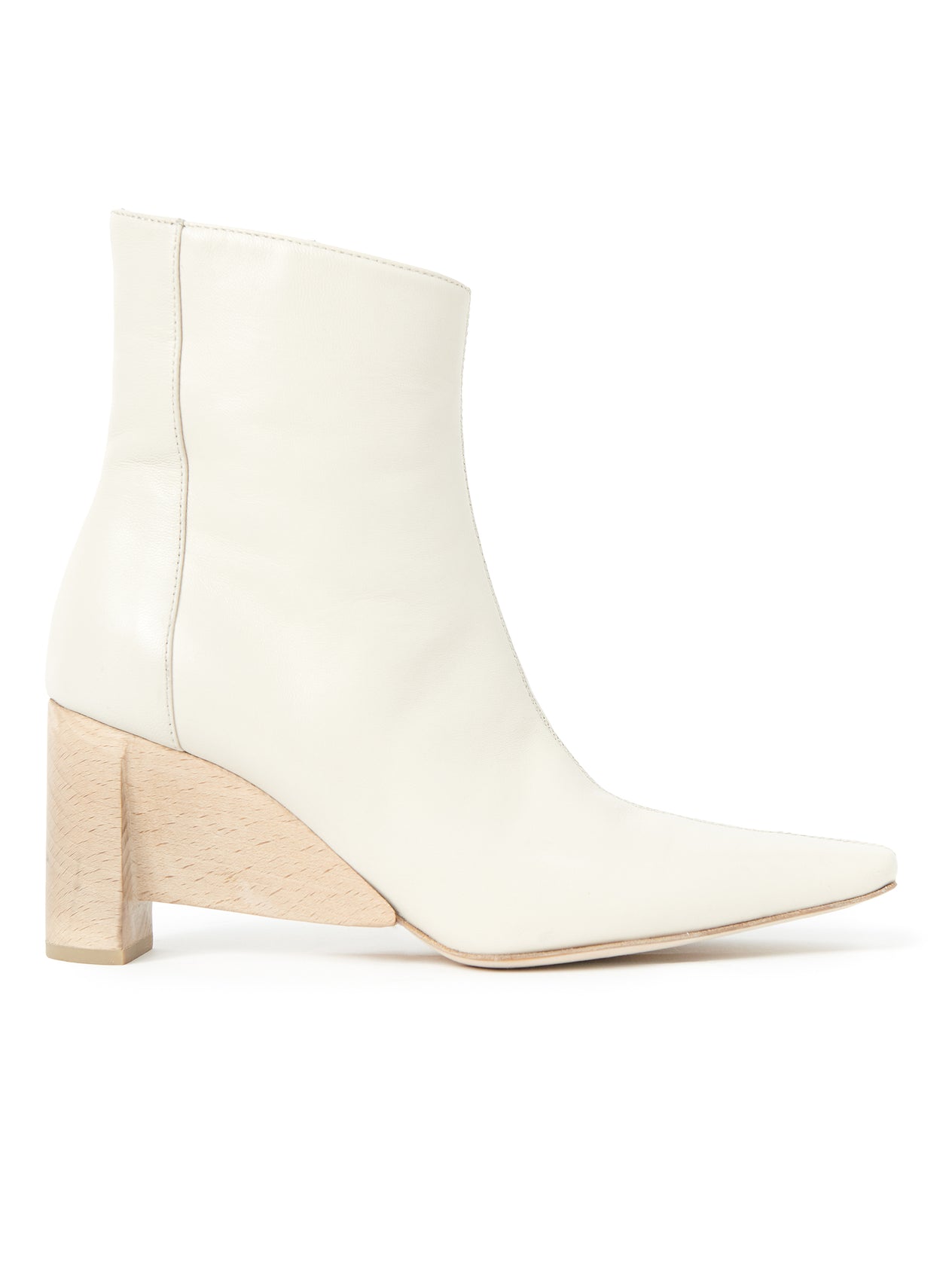 Introducing the Lia Boot by Zero + Maria Cornejo: a sleek white smooth nappa leather ankle boot featuring a pointed toe and a chunky, light wood-textured heel. Crafted in Italy, this minimalist design is showcased against a plain white background.